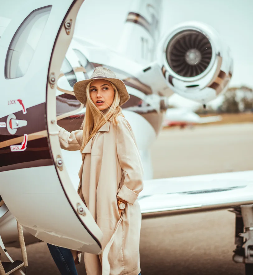 Woman stepping out of a private jet | Dr. Z Facial Plastic Surgery